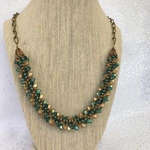 Gold and turquoise hand stitched necklace.